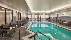 An indoor swimming pool with seating areas and a 'NO DIVING' sign. - Courtyard by Marriott Philadelphia Langhorne (Langhorne)