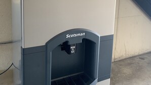 A Scotsman ice dispenser with a push button for ice and a digital display. - Relax Inn & Suites (Dublin)
