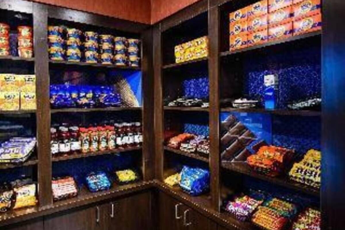 A candy store with shelves stocked with various candies and snacks.