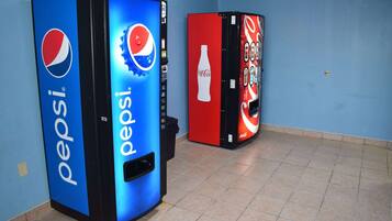 Vending machines with Pepsi and Coca-Cola logos.