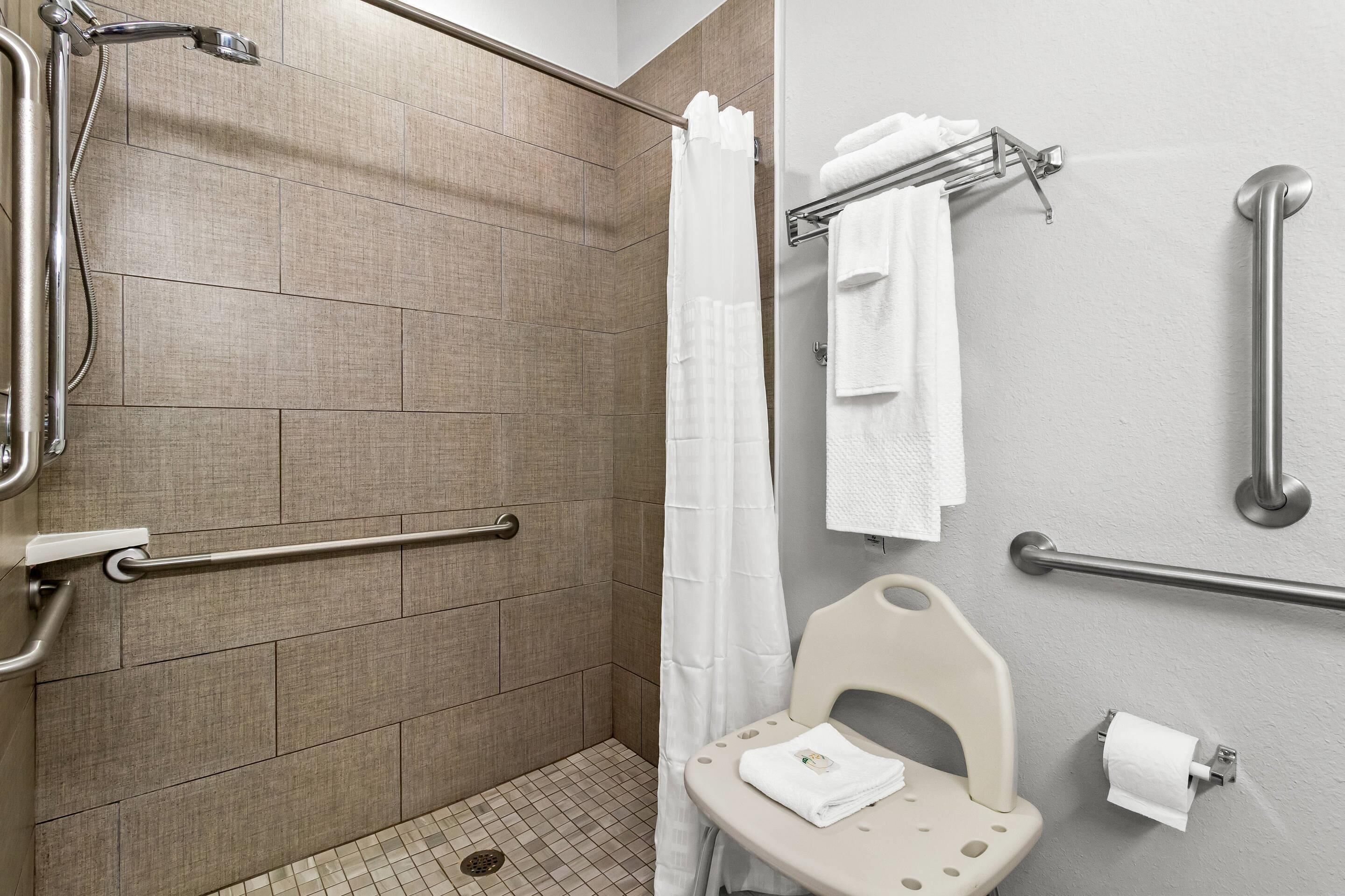 1 king bed, roll in shower accessible, non smoking | bathroom | free toiletries, hair dryer, towels, soap