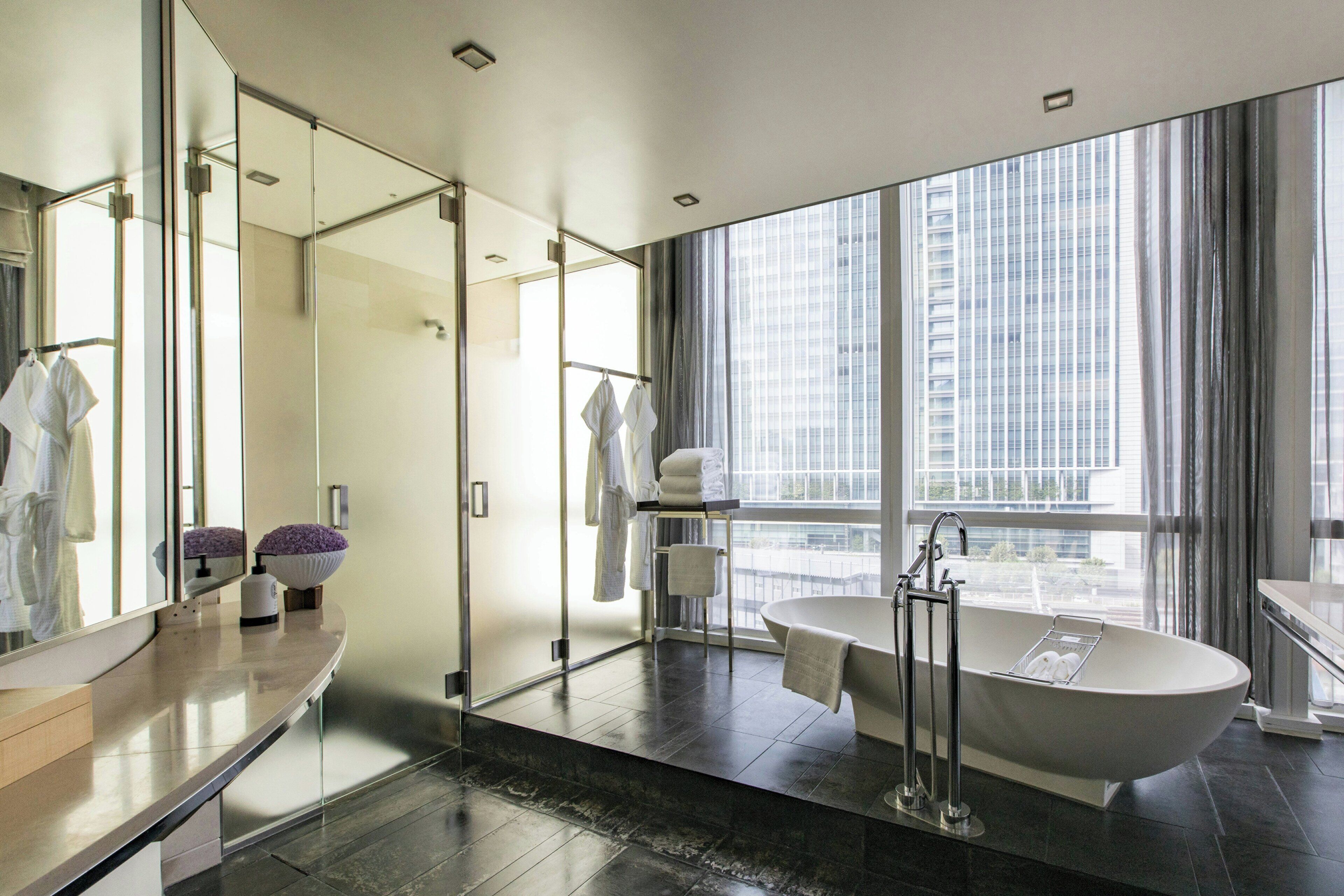 separate bathtub and shower, deep-soaking bathtub, rainfall showerhead