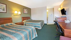 A hotel room with two beds, a desk, a chair, a TV, and a bathroom visible through an open door. - Knights Inn South Hackensack (South Hackensack)