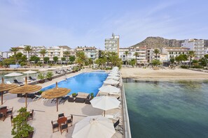 Seasonal outdoor pool, pool umbrellas, pool loungers