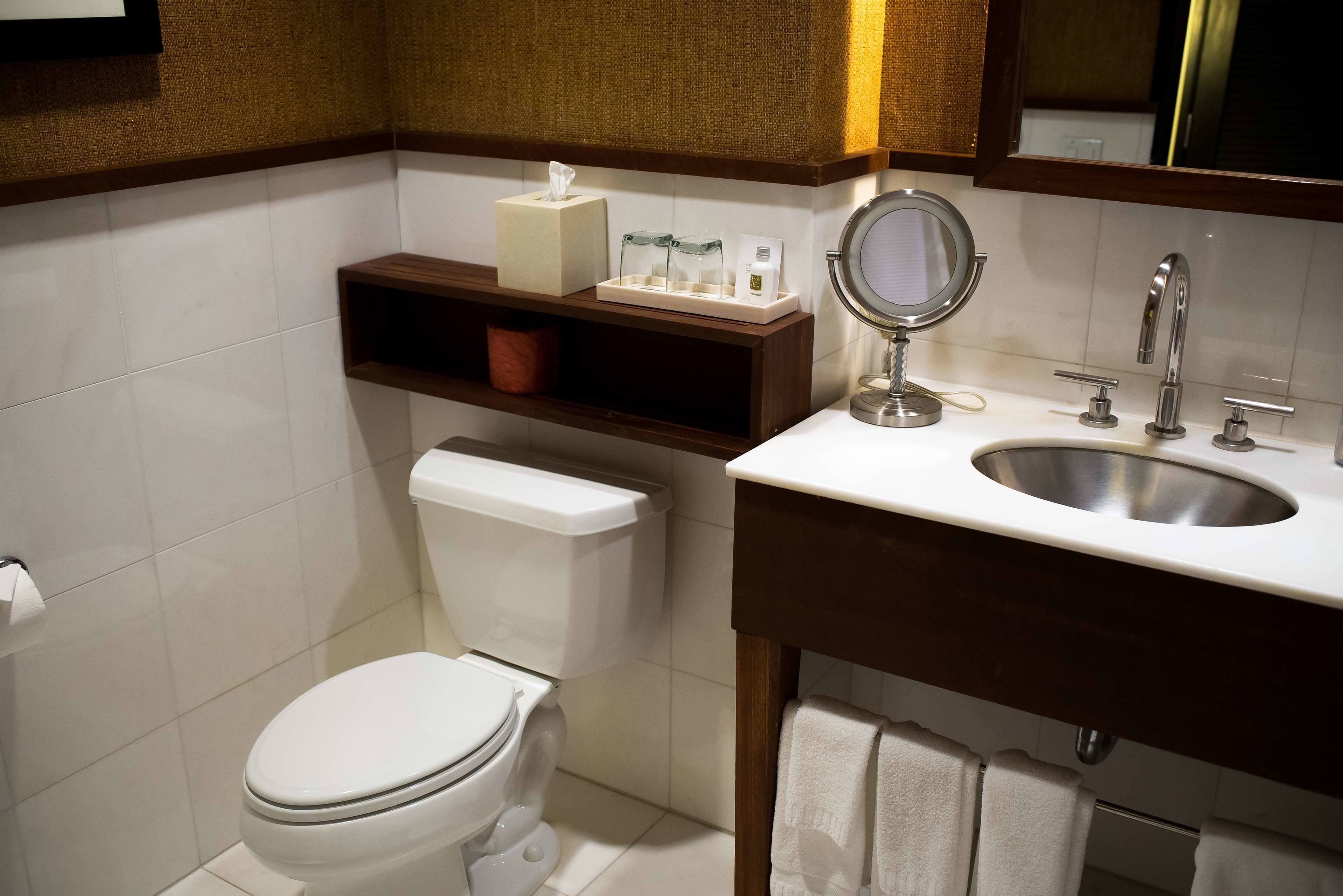 combined shower/bathtub, designer toiletries, hair dryer, bathrobes