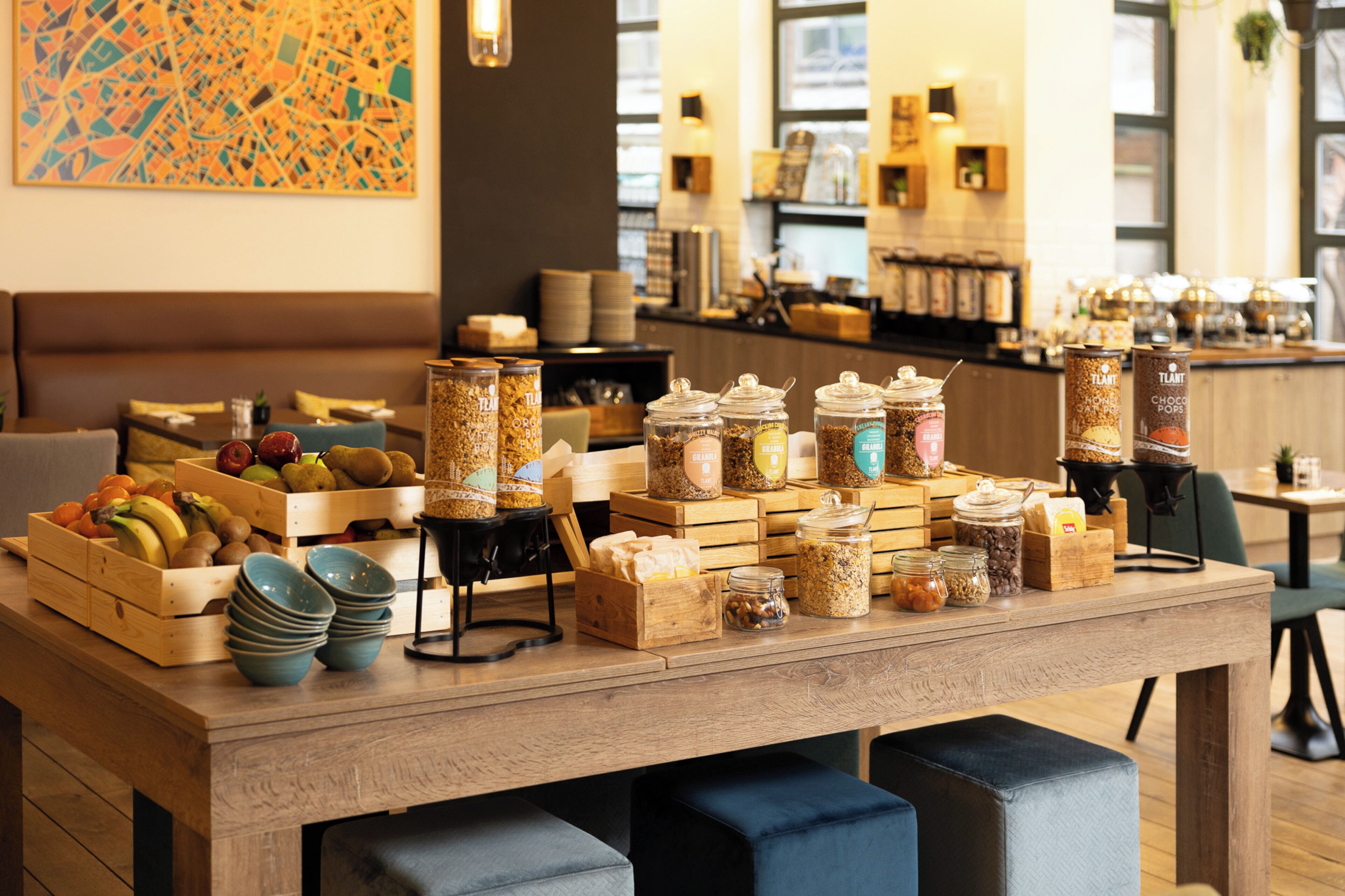 A buffet setup with various food items and containers.
