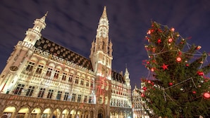 A historic building with intricate architecture and a prominent tower. - Holiday Inn Brussels Schuman by IHG (Brussels)