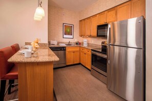Studio, 1 King Bed with Sofa bed | Private kitchen | Full-size fridge, microwave, stovetop, dishwasher
