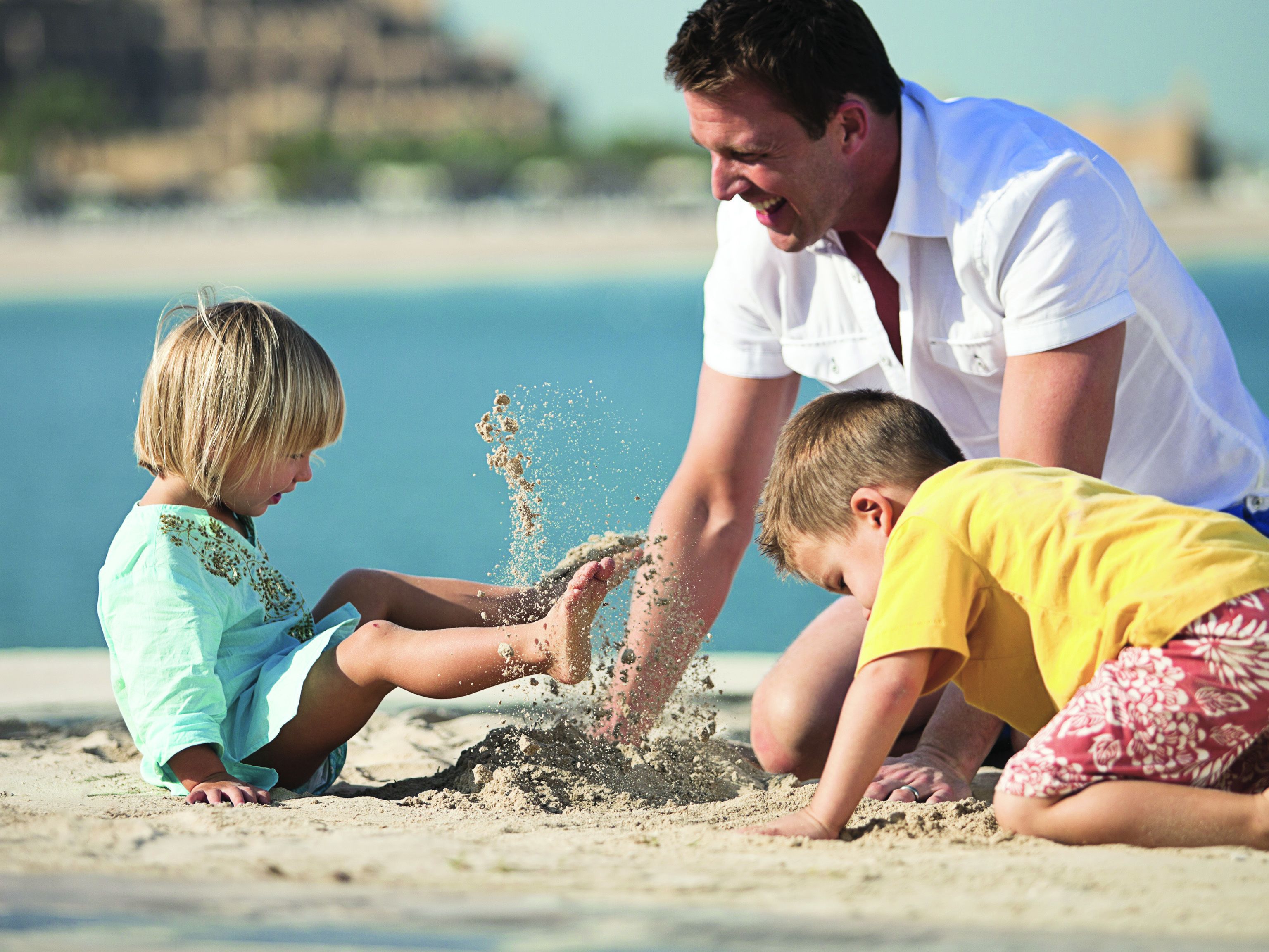 private beach, beach umbrellas, beach volleyball