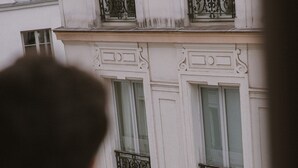 A building facade with ornate balconies and windows. - Hotel Suzie Blue (Paris)