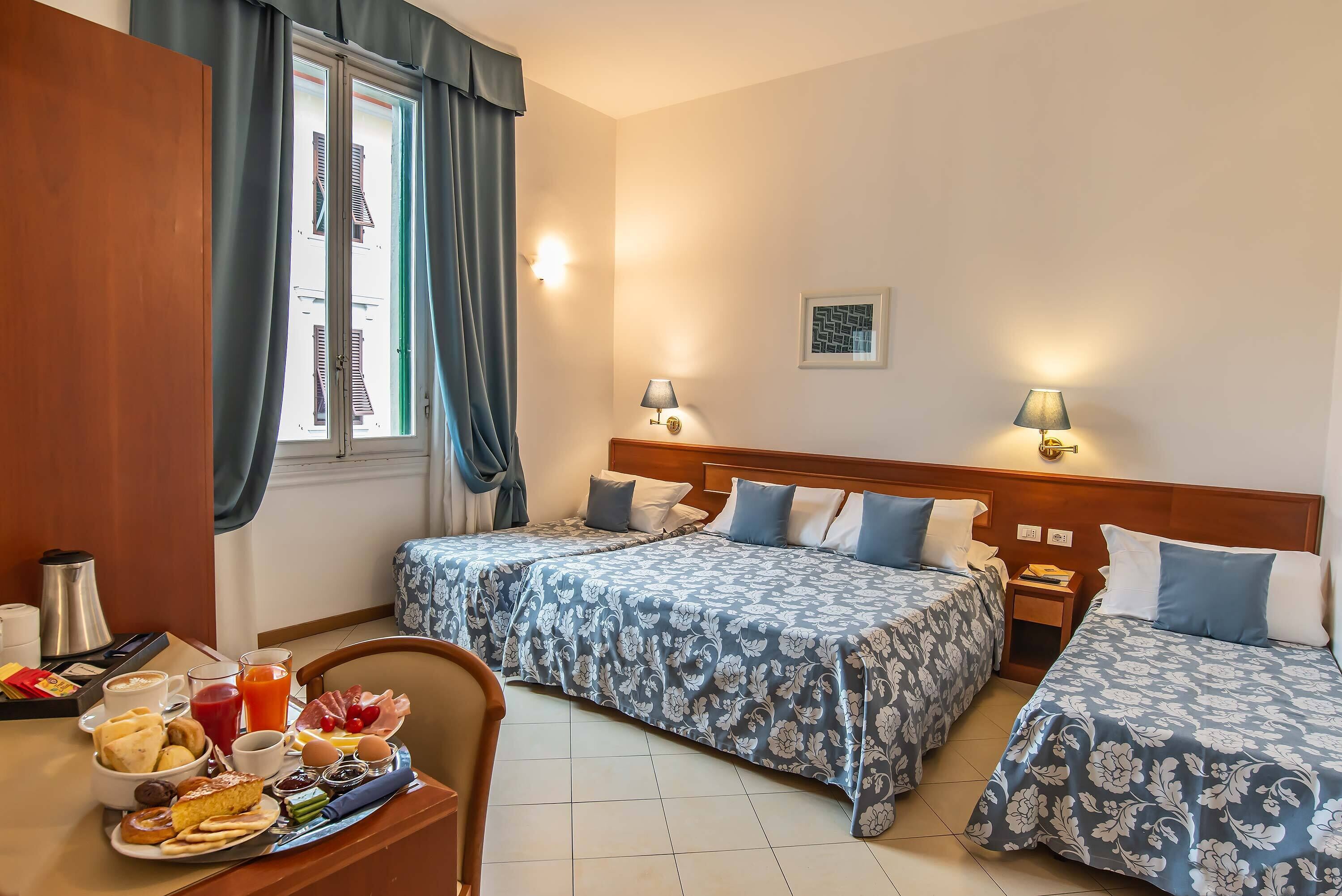 quadruple room | minibar, in-room safe, desk, laptop workspace