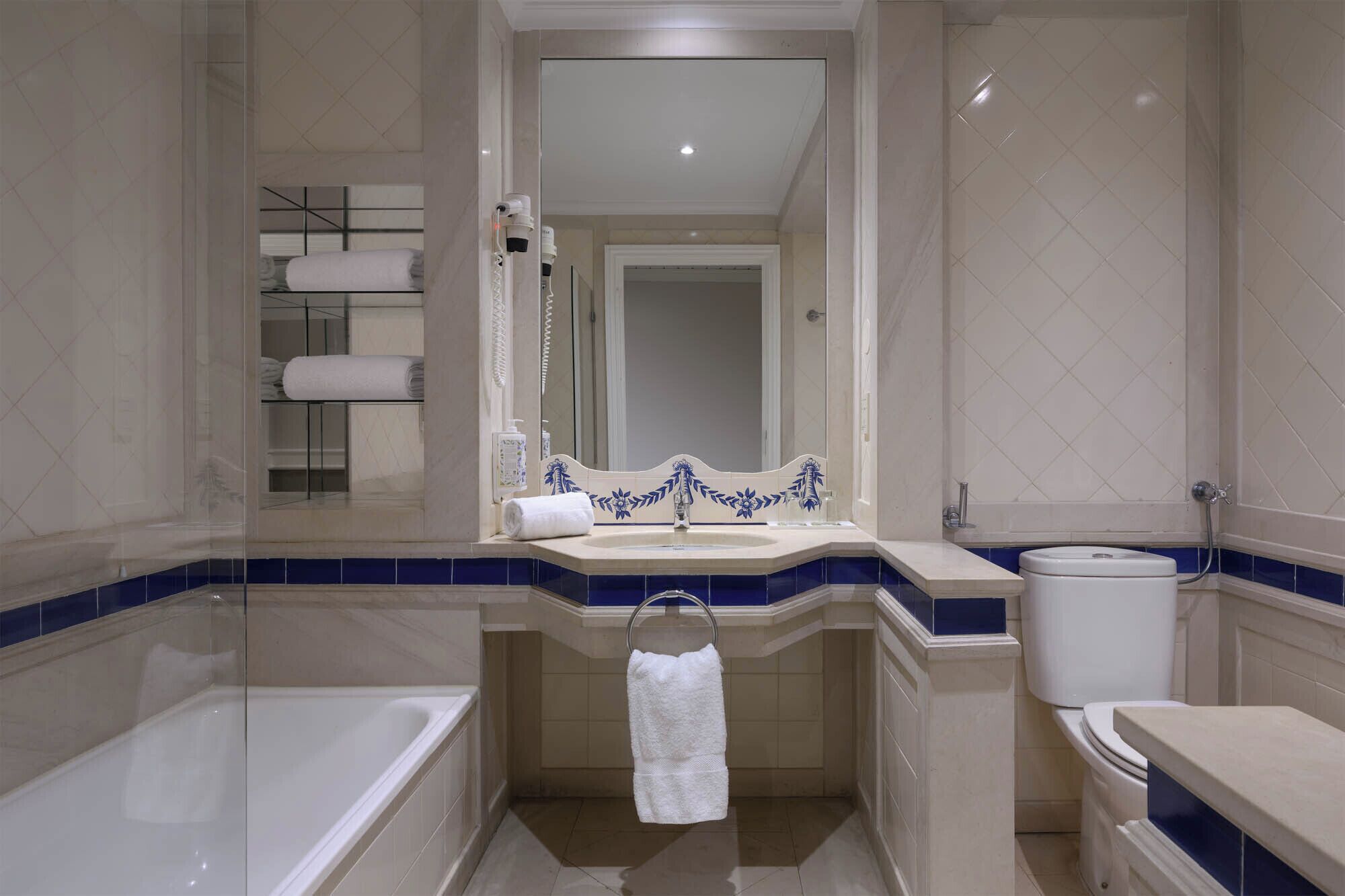 bathtub, free toiletries, hair dryer, towels