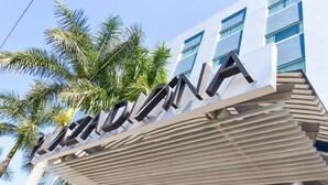 A modern building with a prominent sign reading "RADICONA".