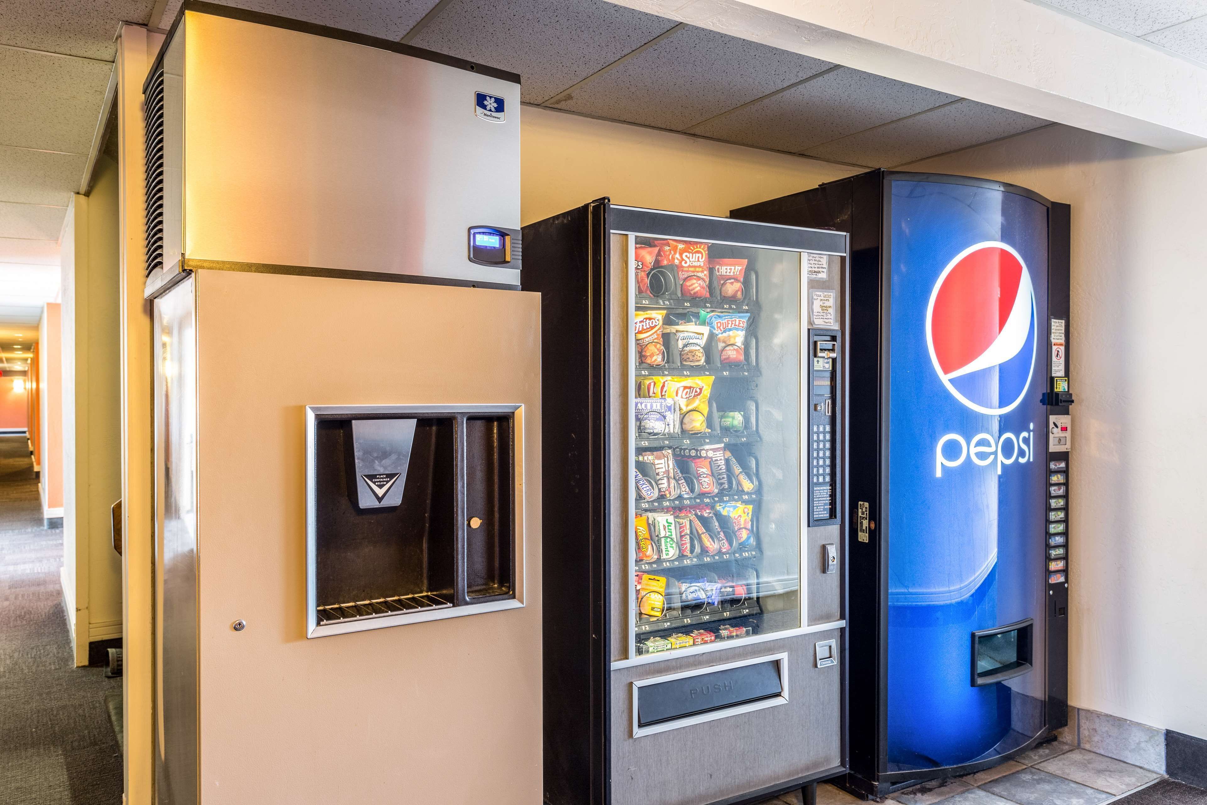 A vending machine with a Pepsi logo and a drink dispenser.