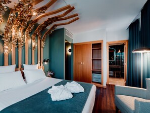 Premium bedding, down duvets, minibar, laptop workspace