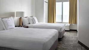 A hotel room with two beds, a bedside table with a lamp, a window with curtains, and a carpeted floor. - Springhill Suites By Marriott - Danbury (Danbury)