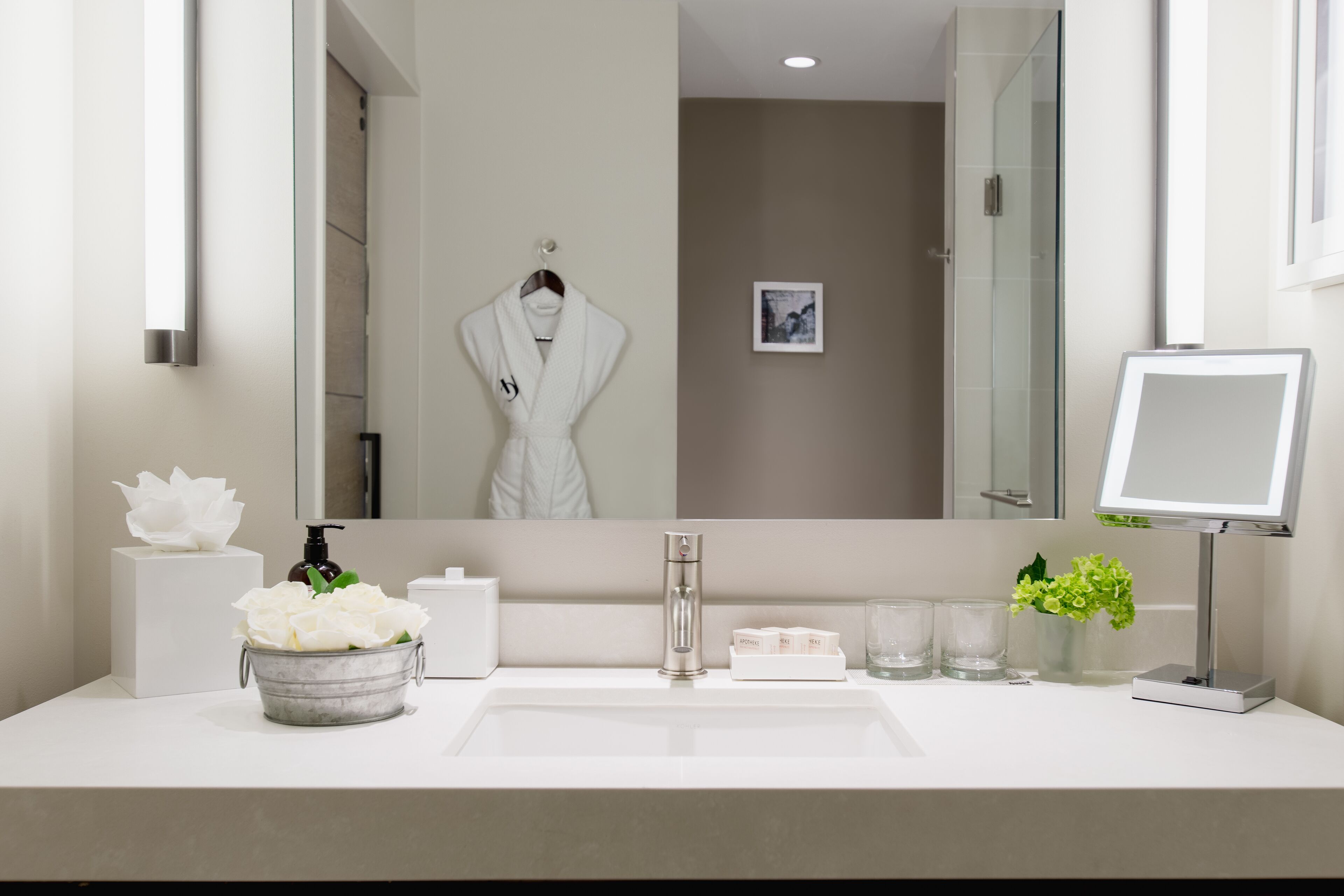 designer toiletries, hair dryer, bathrobes, towels