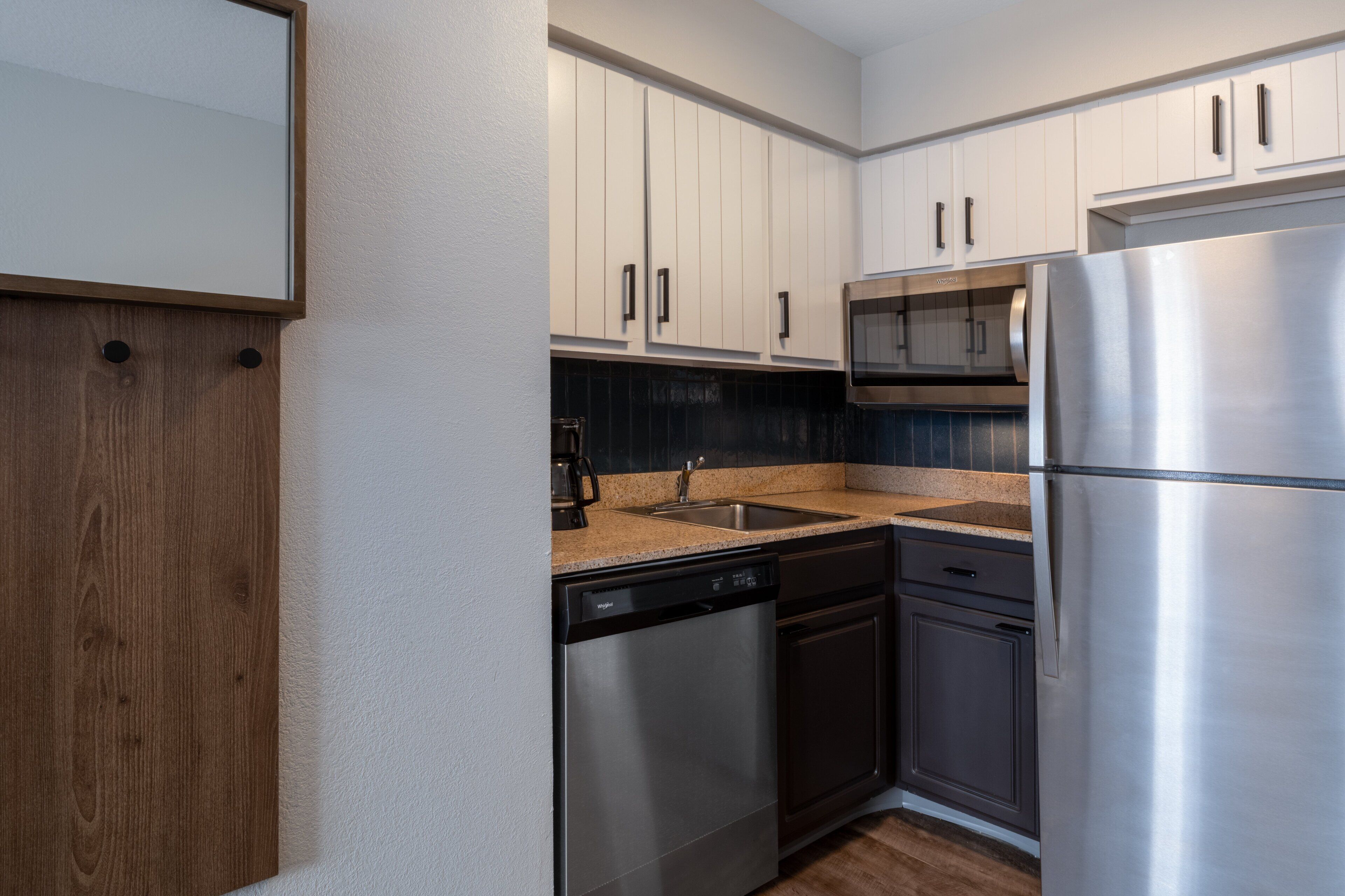 full-sized fridge, microwave, stovetop, dishwasher