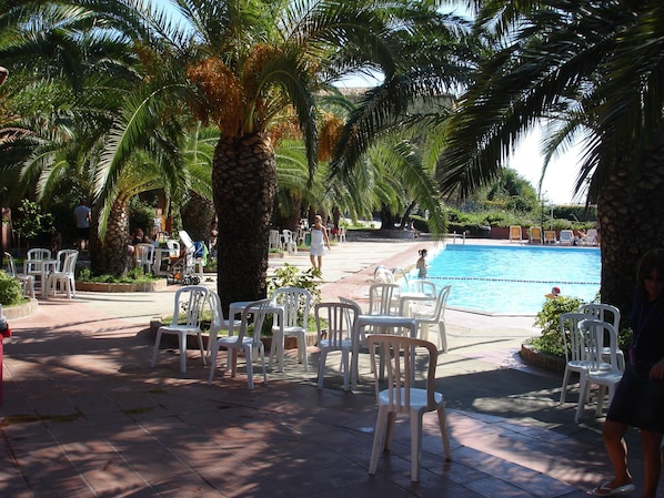 Outdoor pool, open 9:30 AM to 7:00 PM, pool umbrellas, sun loungers