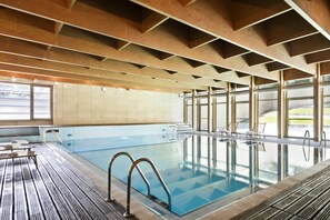 Indoor pool, open 7:00 AM to 11:00 PM, pool loungers