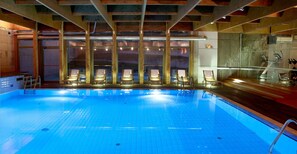 Indoor pool, open 7:00 AM to 11:00 PM, pool loungers