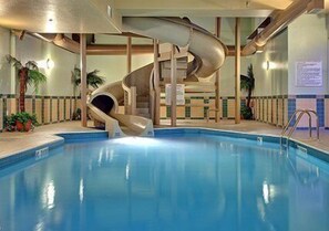 An indoor swimming pool with a spiral slide. - Comfort Inn & Suites (Salmon Arm)