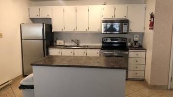 Suite, 1 King Bed, Non Smoking, 2nd floor | Pillowtop beds, desk, blackout drapes, iron/ironing board