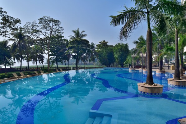 Outdoor pool, open 6:00 AM to 11:00 PM, pool umbrellas, pool loungers