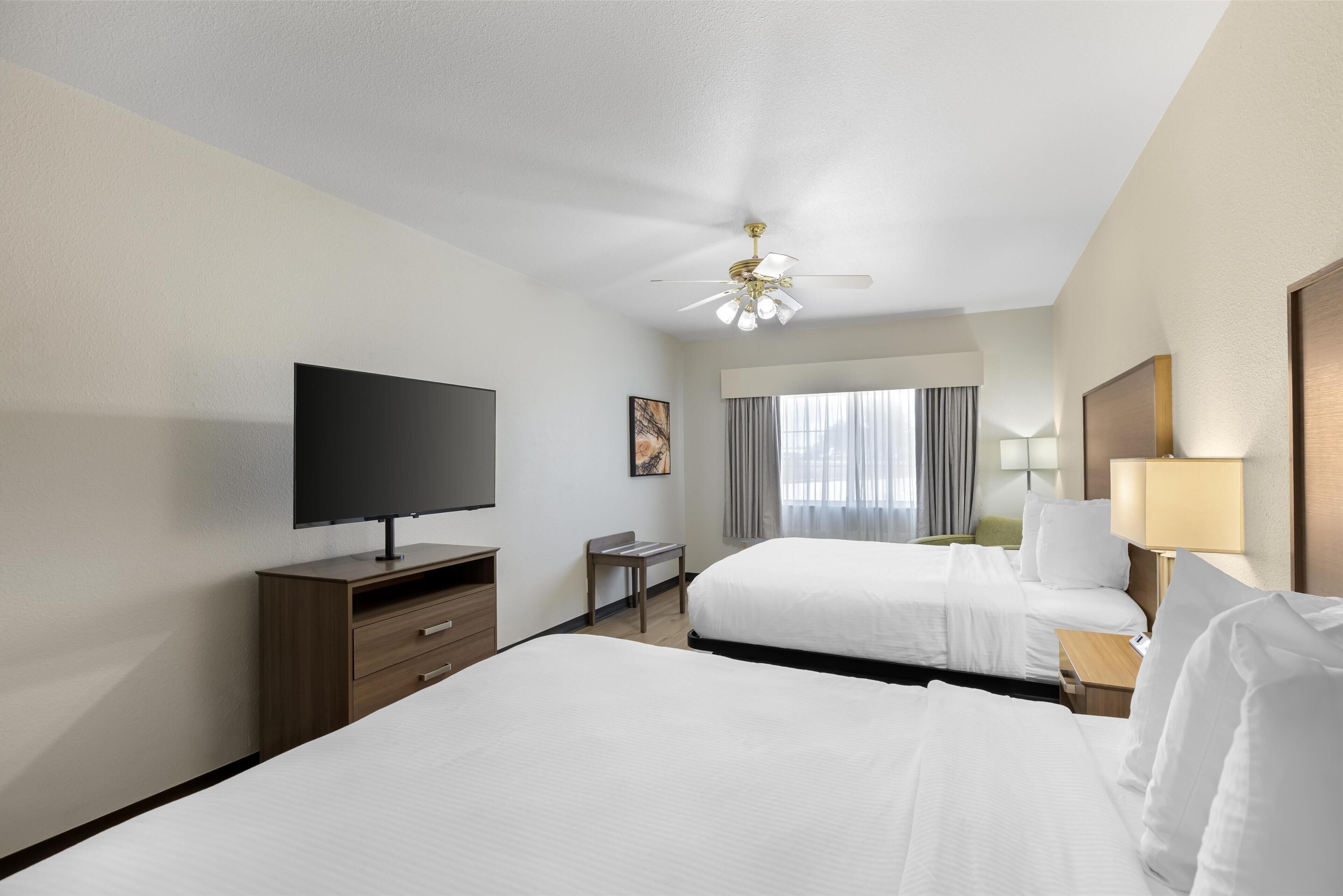 standard room, 2 queen beds, non smoking, refrigerator & microwave | 1 bedroom, desk, laptop workspace, iron/ironing board