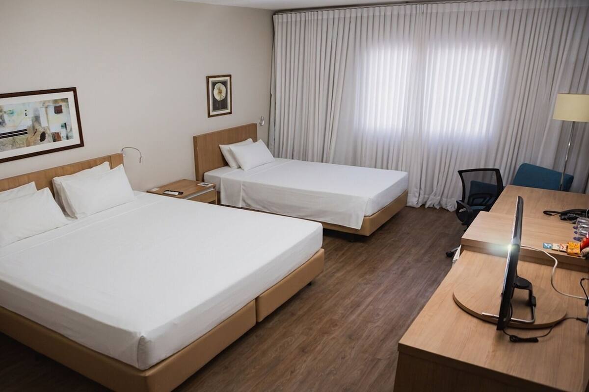 Family Room | Minibar, desk, WiFi (free), bed sheets