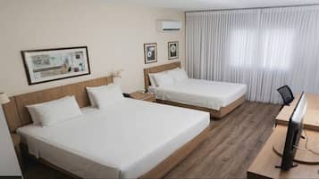 Family Room | Minibar, desk, WiFi (free), bed sheets