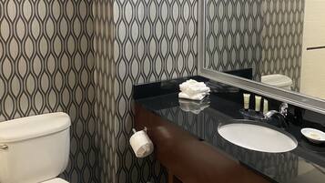 Combined shower/bathtub, designer toiletries, hair dryer, towels