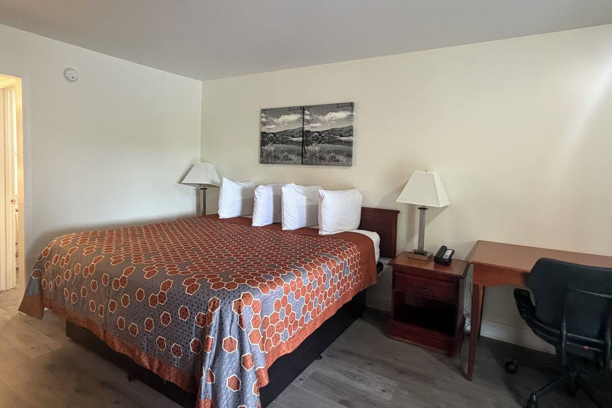 Desk, laptop workspace, blackout curtains, free WiFi