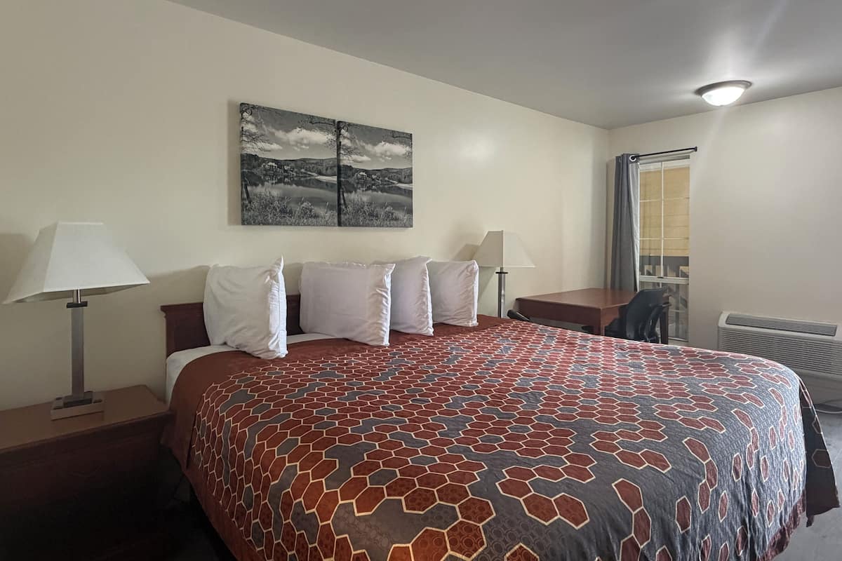 Desk, laptop workspace, blackout curtains, free WiFi