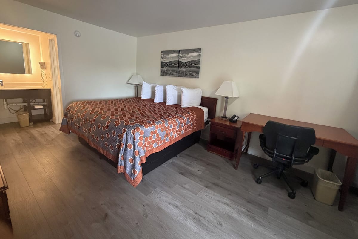 Desk, laptop workspace, blackout curtains, free WiFi