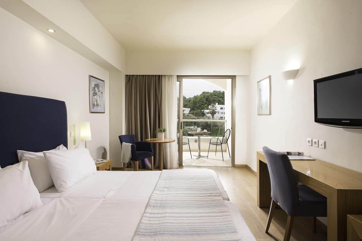 Double Room Inland View | 1 bedroom, in-room safe, desk, blackout drapes