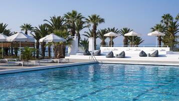 Indoor pool, outdoor pool, pool umbrellas, pool loungers