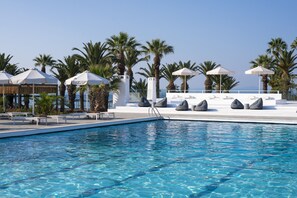 Indoor pool, outdoor pool, pool umbrellas, pool loungers