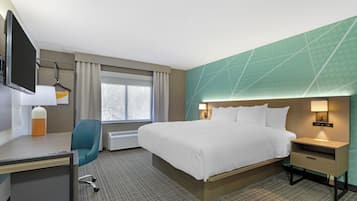 Suite, 1 King Bed, Non Smoking | Desk, laptop workspace, blackout drapes, iron/ironing board