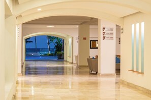 Step into the lobby and enjoy stunning ocean views through the arched doorway.