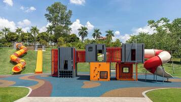 A playground with slides and climbing structures.