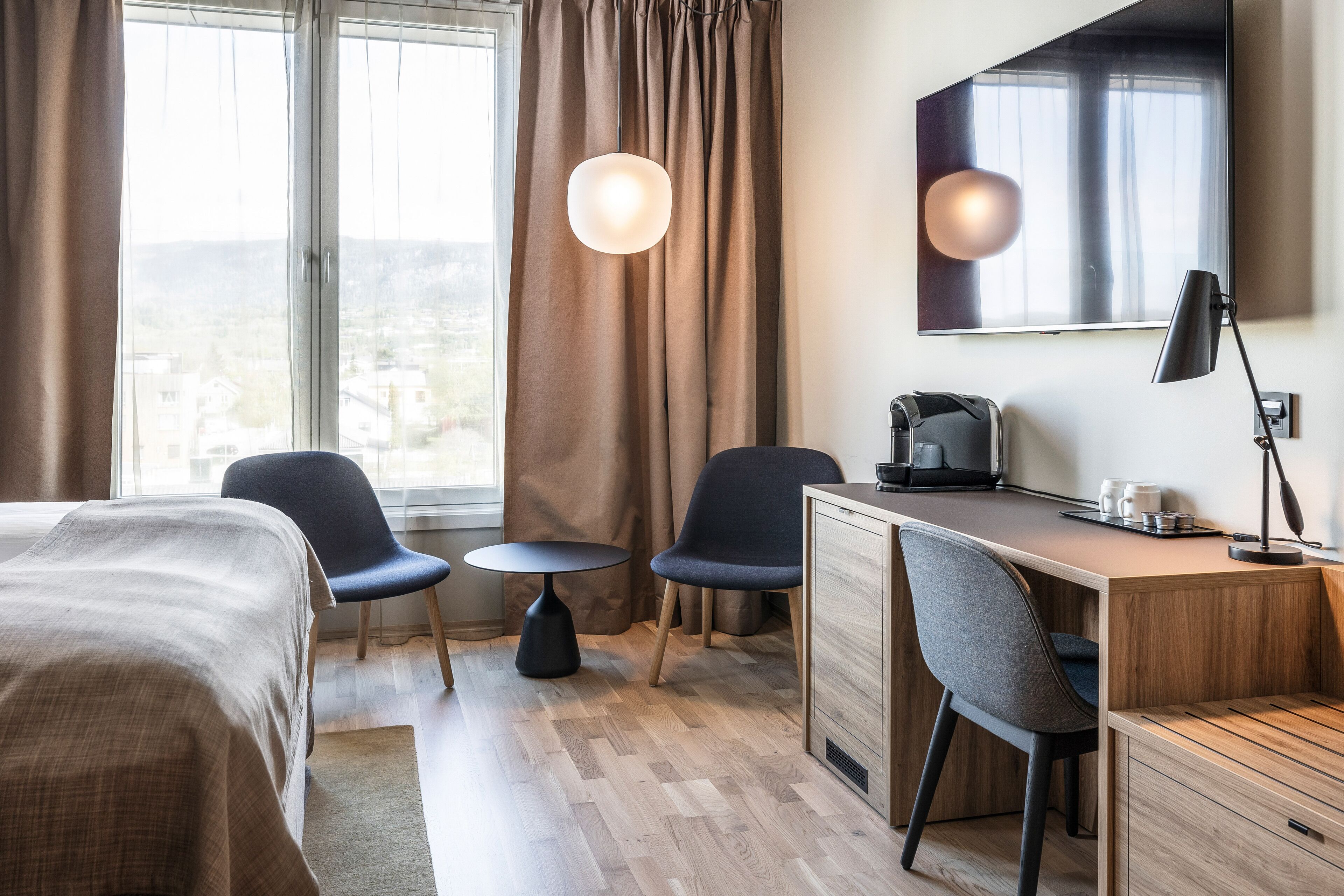 deluxe room, 2 single beds | 1 bedroom, desk, laptop workspace, cots/infant beds