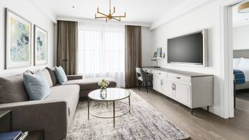 A modern living room with a sofa, coffee table, and TV.