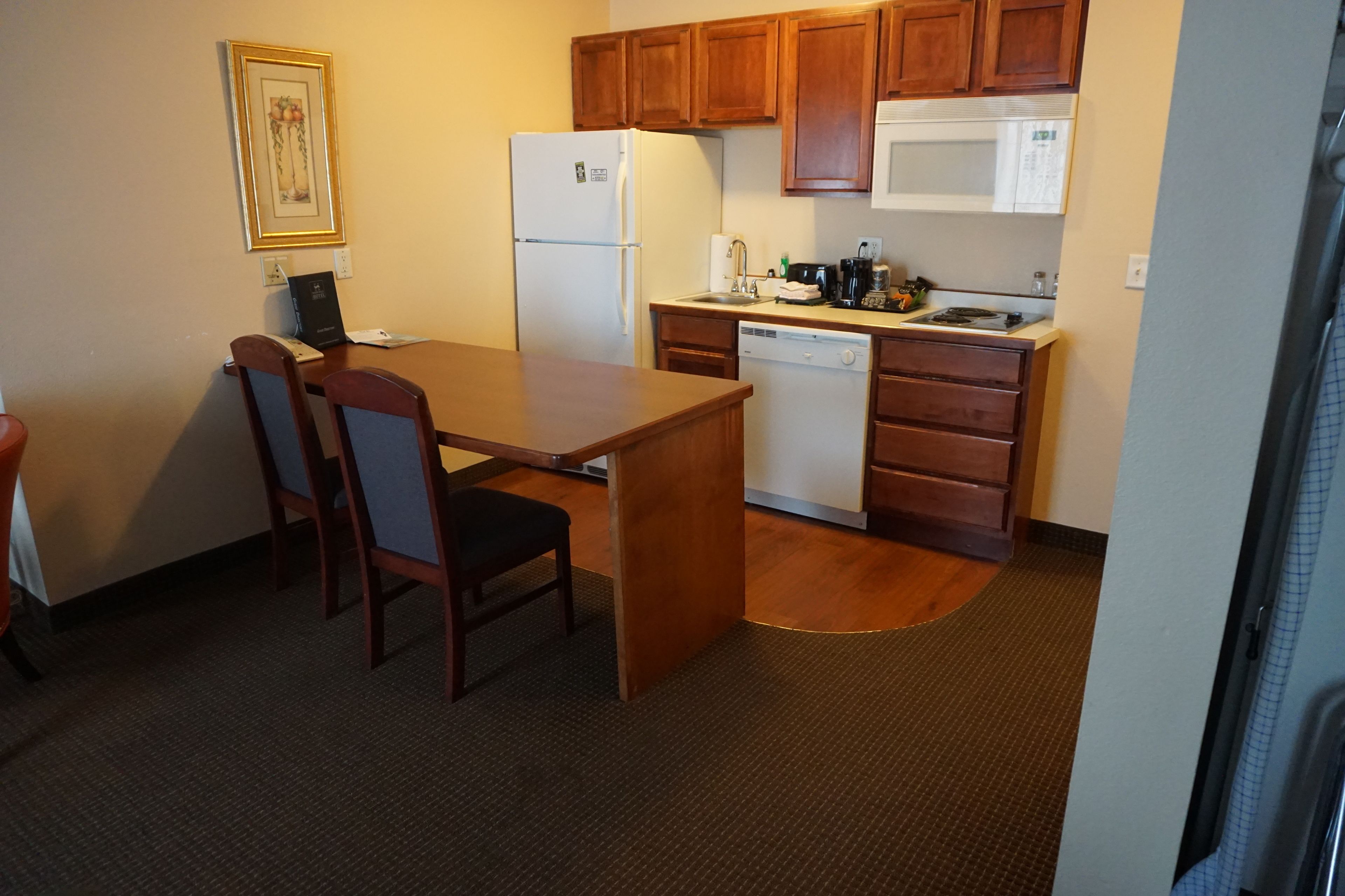 full-sized fridge, microwave, stovetop, dishwasher