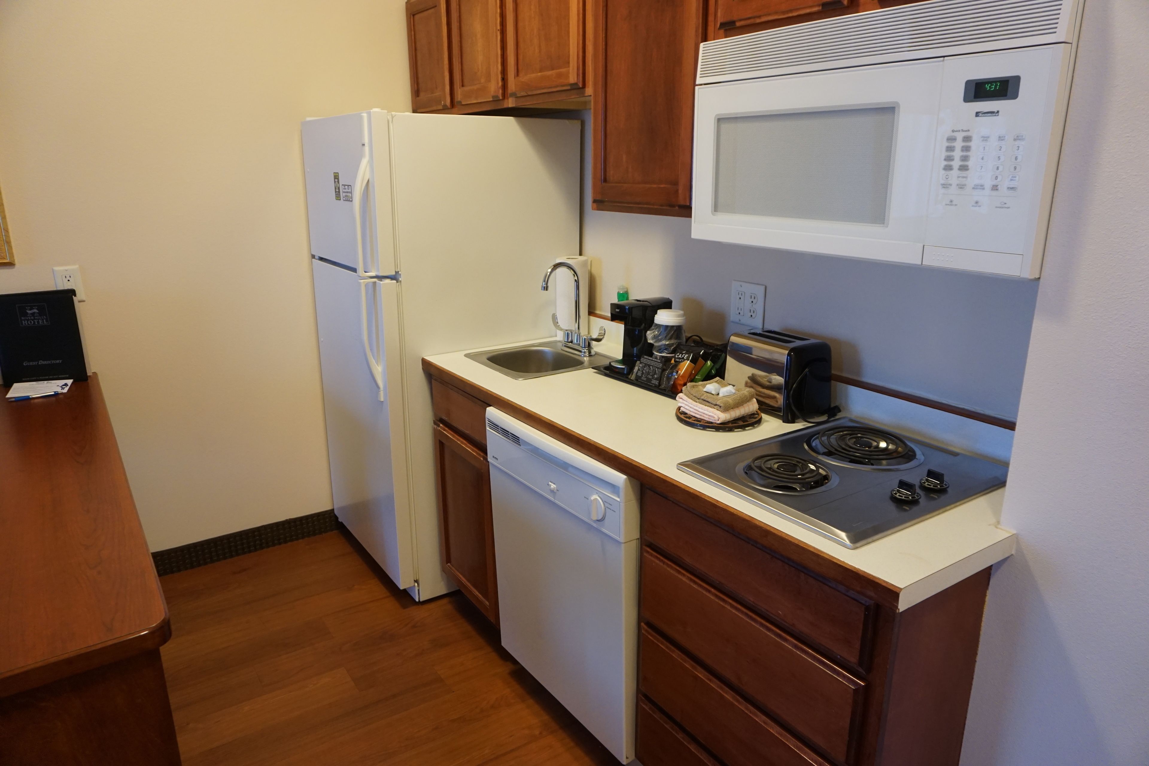 full-sized fridge, microwave, stovetop, dishwasher