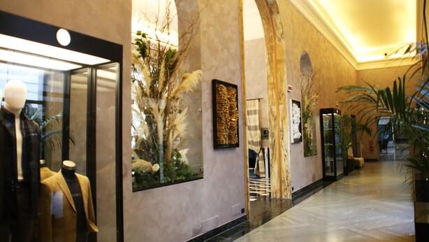 A hotel lobby with marble flooring, arched doorways, and a reception desk. - TH Roma - Carpegna Palace (Rome)