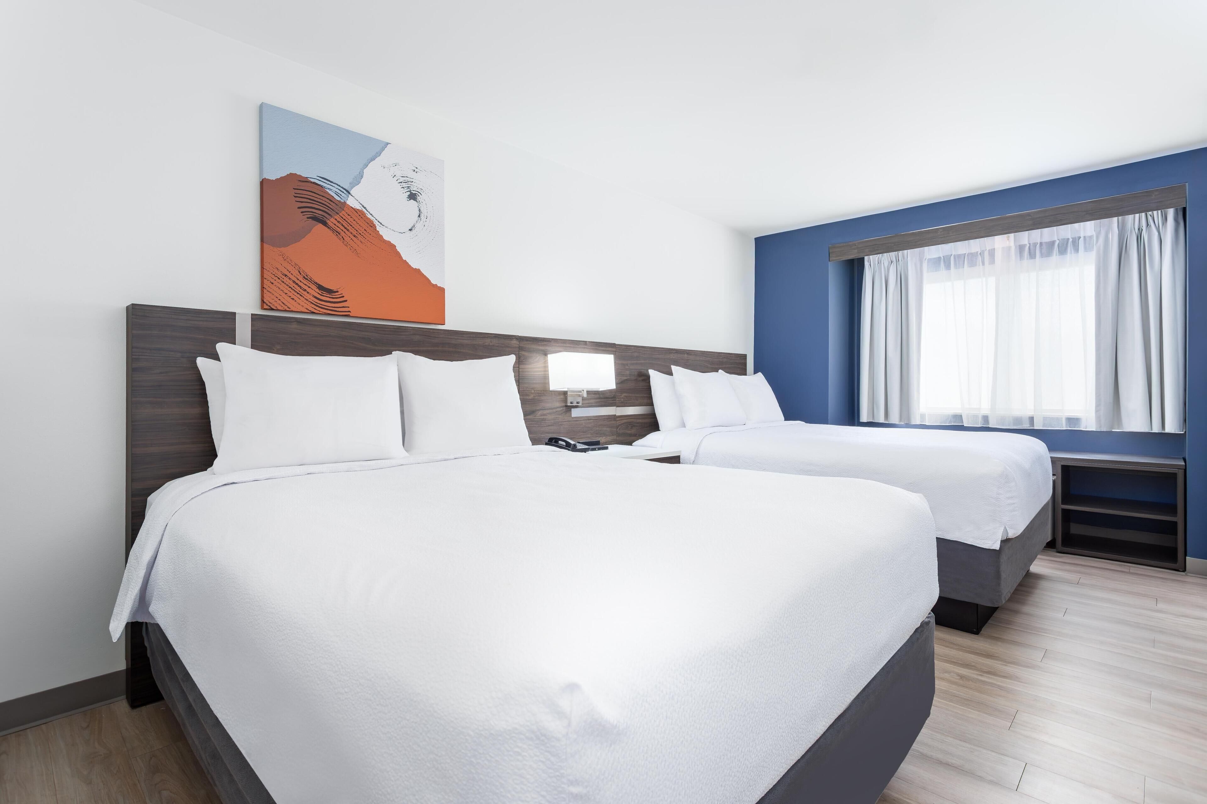 Room, 2 Queen Beds | Desk, laptop workspace, blackout drapes, free WiFi