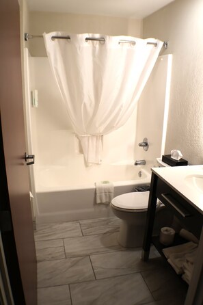 Standard Room, 2 Queen Beds, Non Smoking | Bathroom | Combined shower/tub, free toiletries, hair dryer, towels