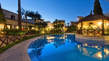 Seasonal outdoor pool, open 11:00 AM to 7:00 PM, pool umbrellas