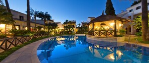 Seasonal outdoor pool, open 11:00 AM to 7:00 PM, pool umbrellas